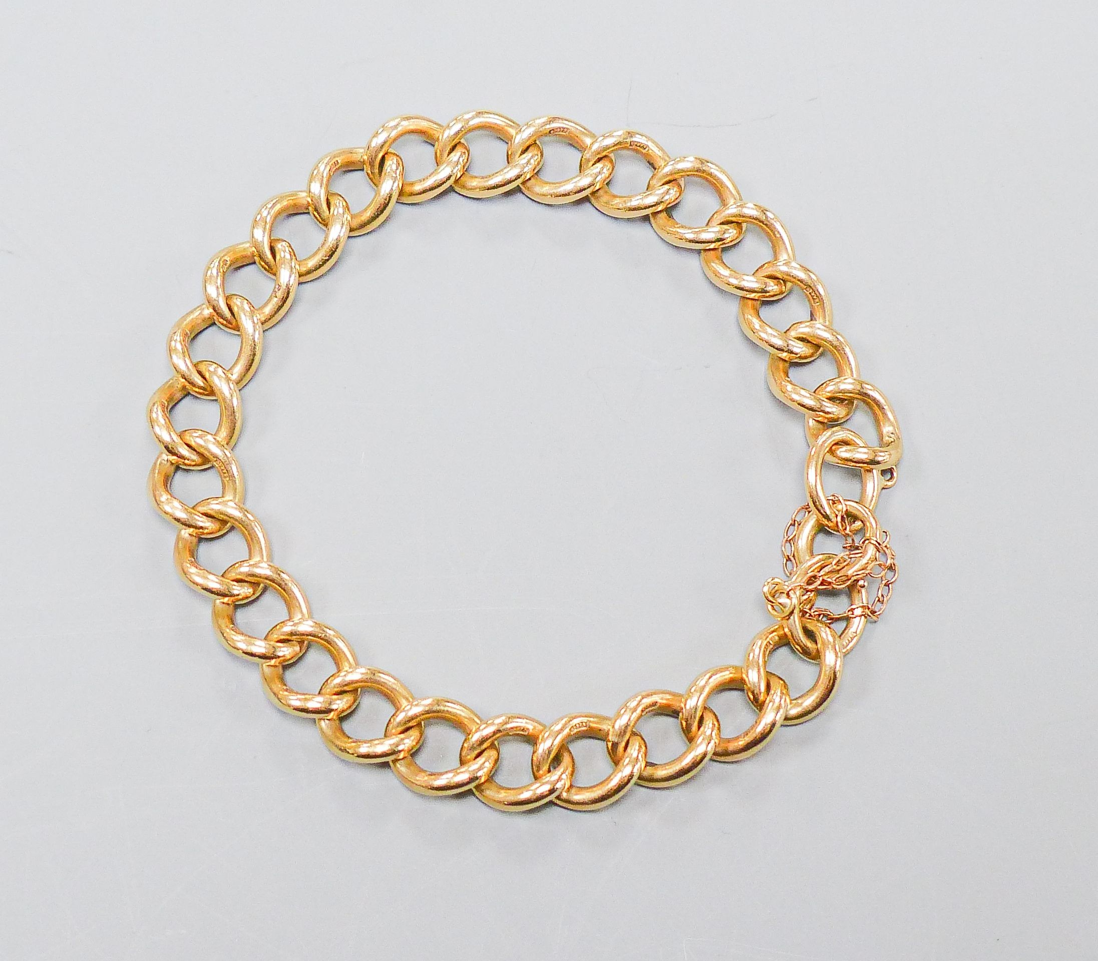 A 9ct gold curb-link bracelet, 20cm, 30.6 grams.